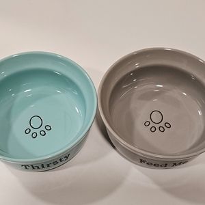 Matching pet bowls. “Feed me” and “thirsty”